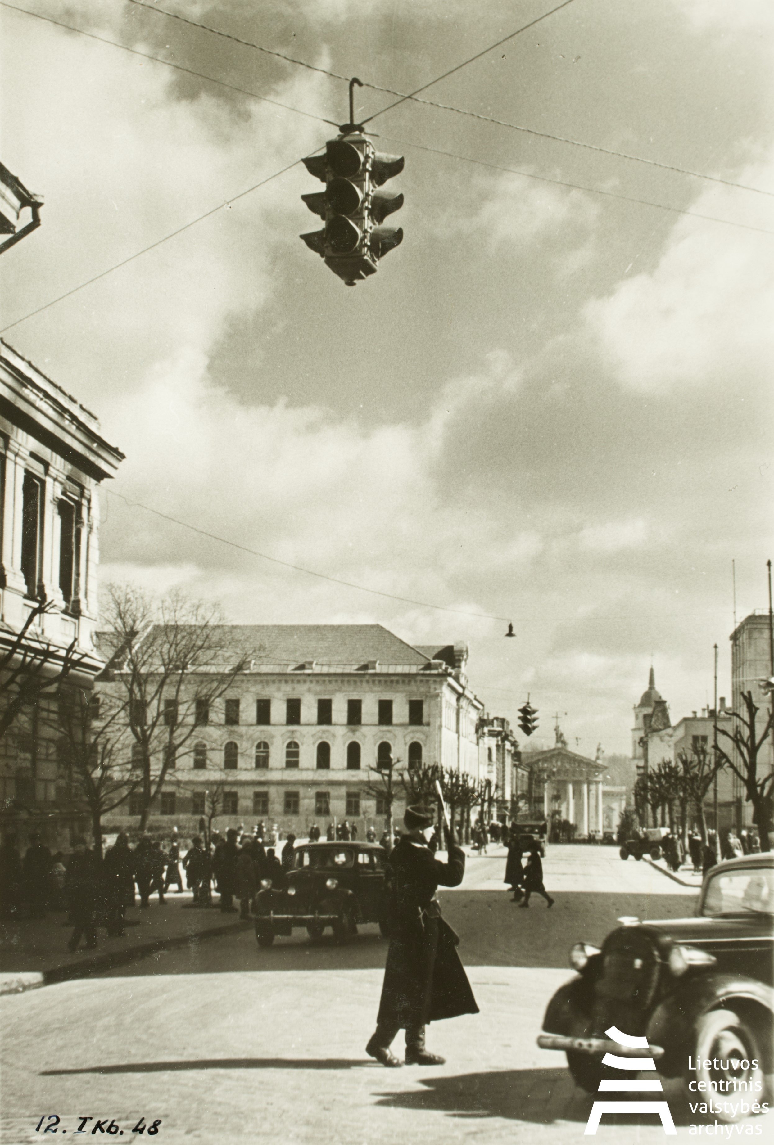 Lithuanian Central State Archives, A police officer regulating traffic next to the Central Committee (CK) building of the Lithuanian Communist Party (LKP) on Gediminas Avenue, Vilnius, Lithuania. 1947-1949.